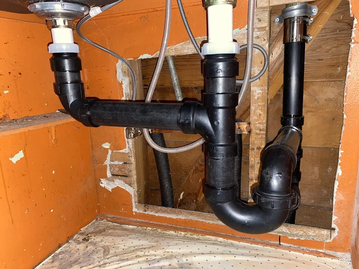 Professional Garbage Disposal Repair equipment and tools on the job in Edgewood